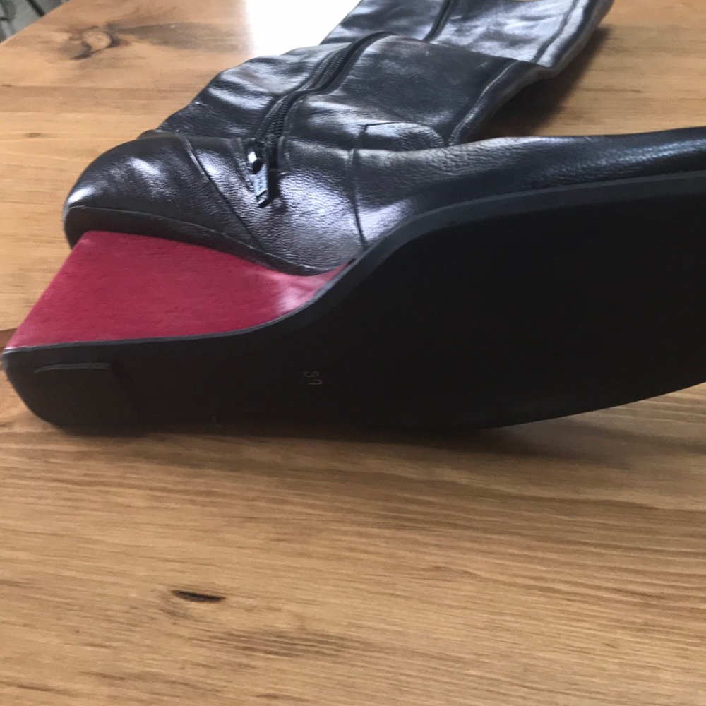 Black boots with red heels. Must have thin calves.